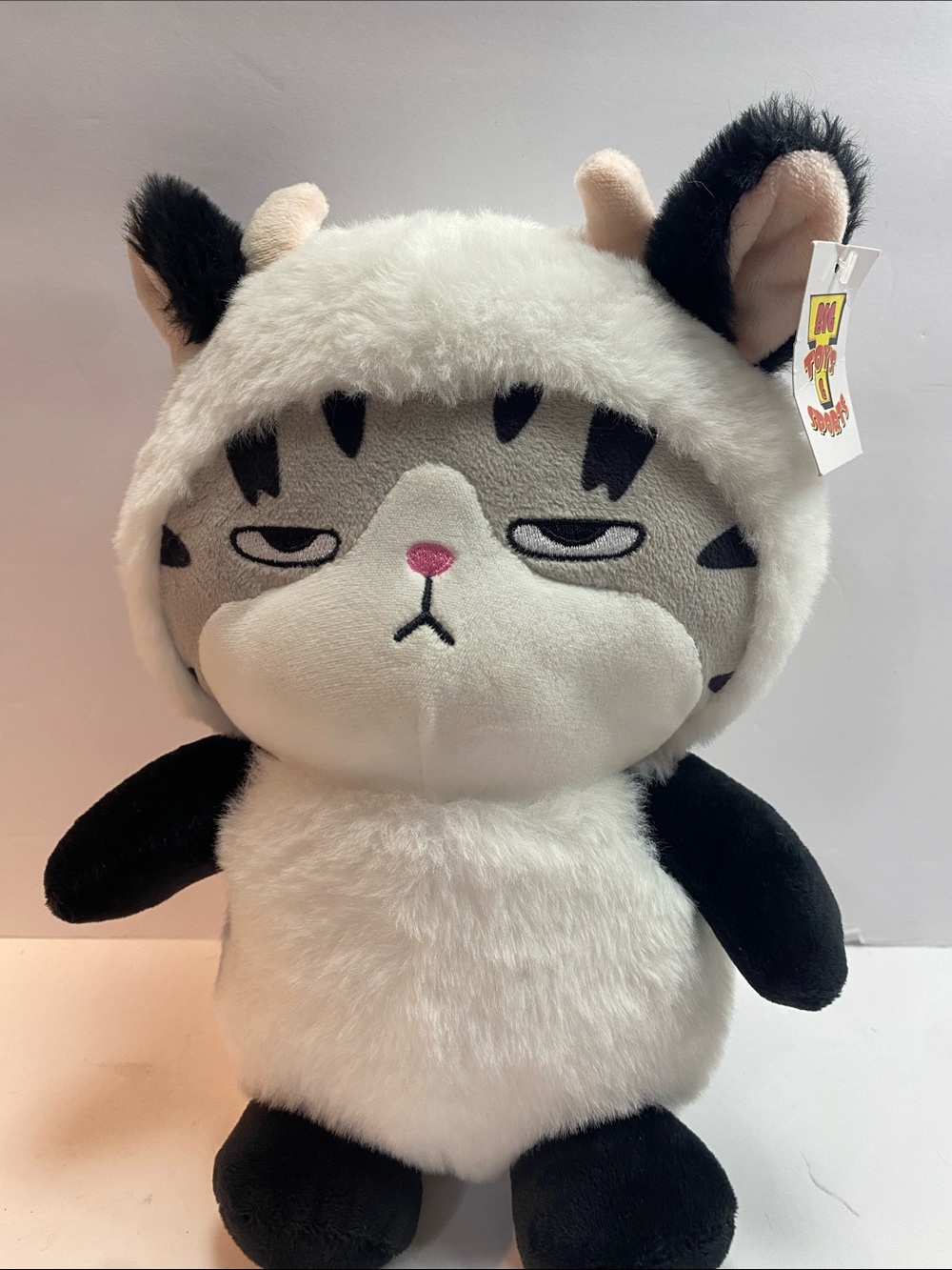 Angry tabby cat in cow costume plush 11 inch